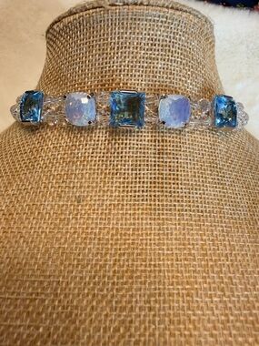 Genuine Swarovski Blue and Clear Crystal.
Made by Swarovski with Swan Clasp